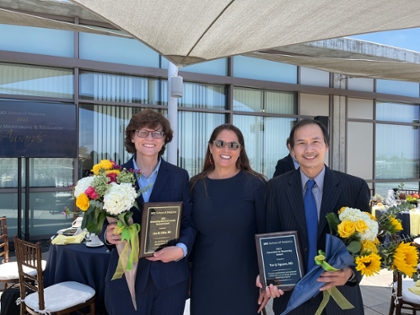 Drs. Gibbs and Nguyen receiving awards